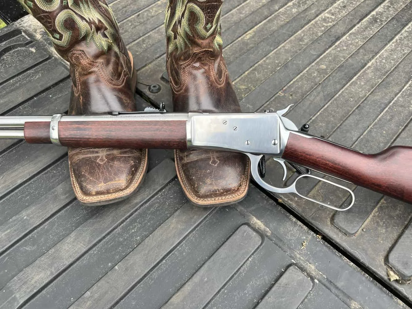 Rossi R92 side photo on cowboy boots