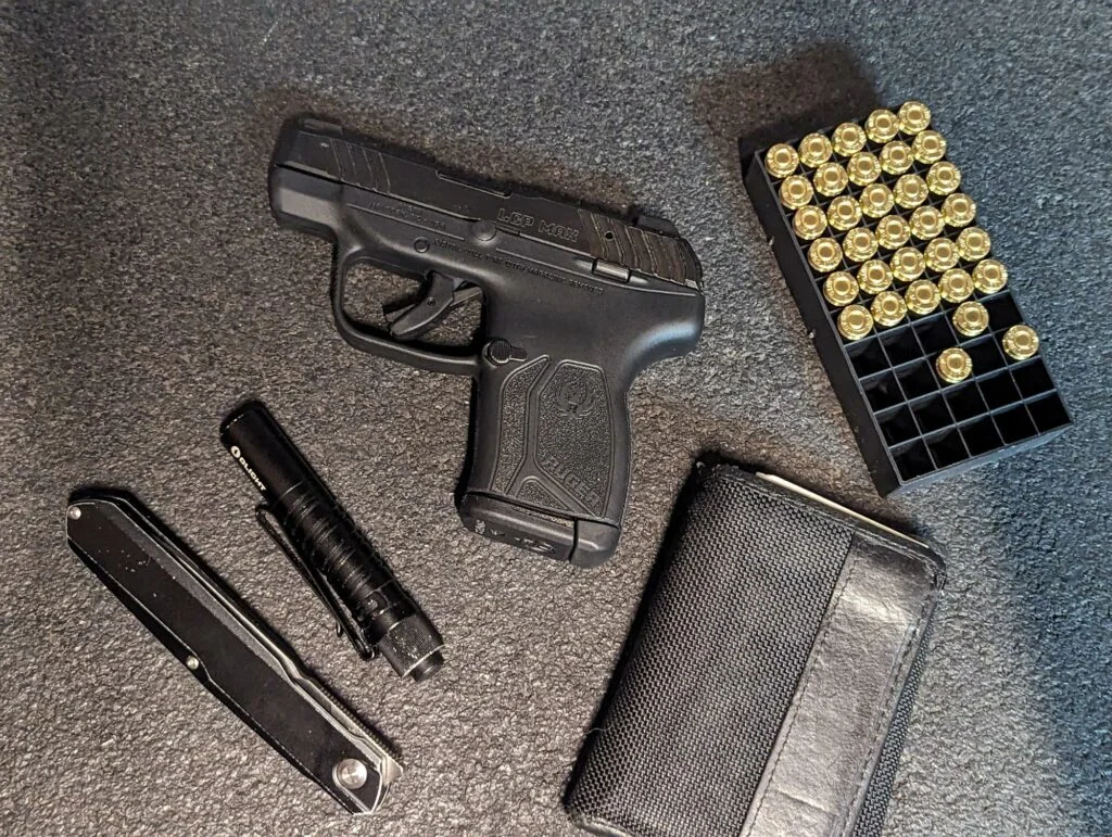 ruger lcp max review with 380 auto ammo and magazine flashlight