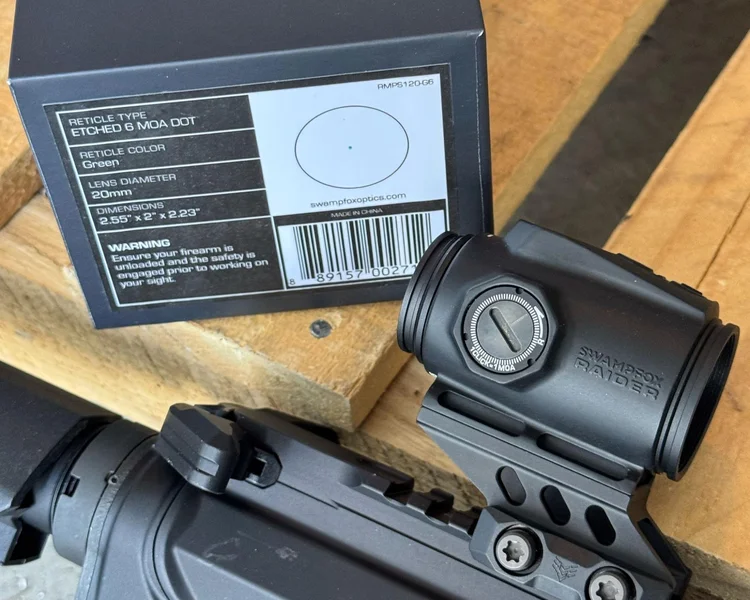 A compact Swampfox Raider Micro Prism mounted on a rifle, showcasing its minimalist and functional design