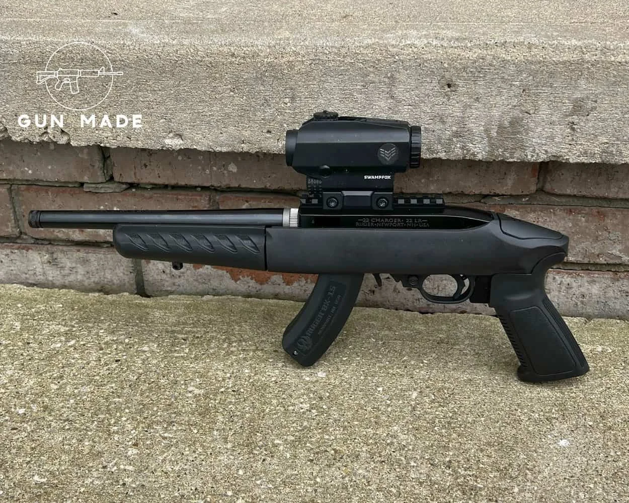 Ruger 22 Charger lined up against brick