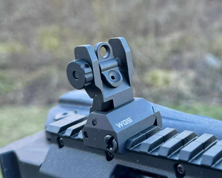 Close-up of AR-15 with dual aperture system for versatile sighting options