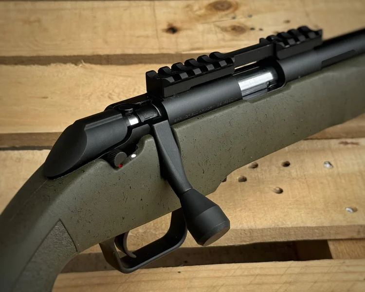 A close-up of the rifle’s 60-degree bolt handle, demonstrating its ergonomic design that aids in quick and smooth cycling.