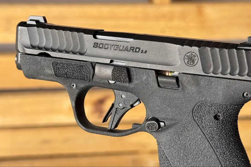Close-up of Smith & Wesson Bodyguard 2.0 flat-face trigger and frame texturing