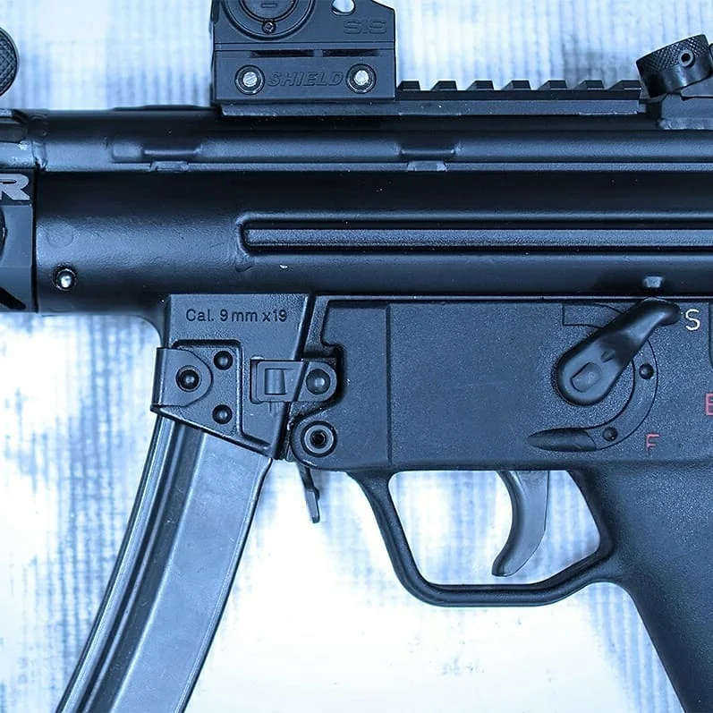 PTR 9C 9mm pistol with HK 3-lug flash hider, Inforce light, and Shield red dot optic.
