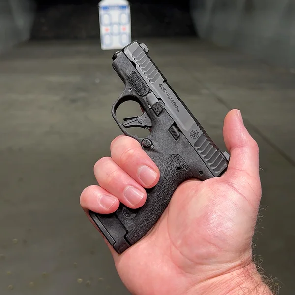Shooter holding a Smith & Wesson Bodyguard 2.0 with a 12-round extended magazine