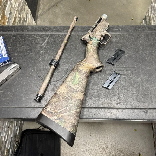 Henry Survival Rifle being assembled at an outdoor shooting range
