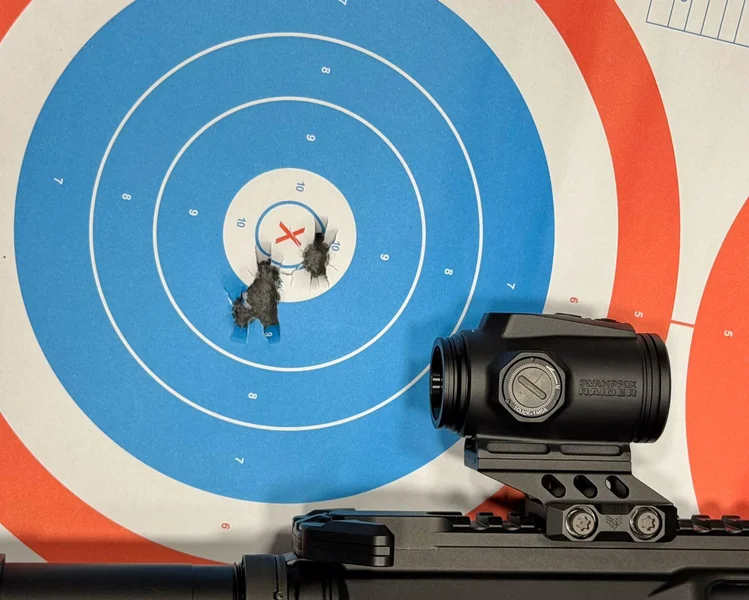Tight shot grouping on a target achieved using the Swampfox Raider, demonstrating its precision