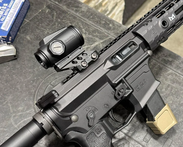 Close-up of the Swampfox Raider with its sleek blacked-out branding visible on the optic