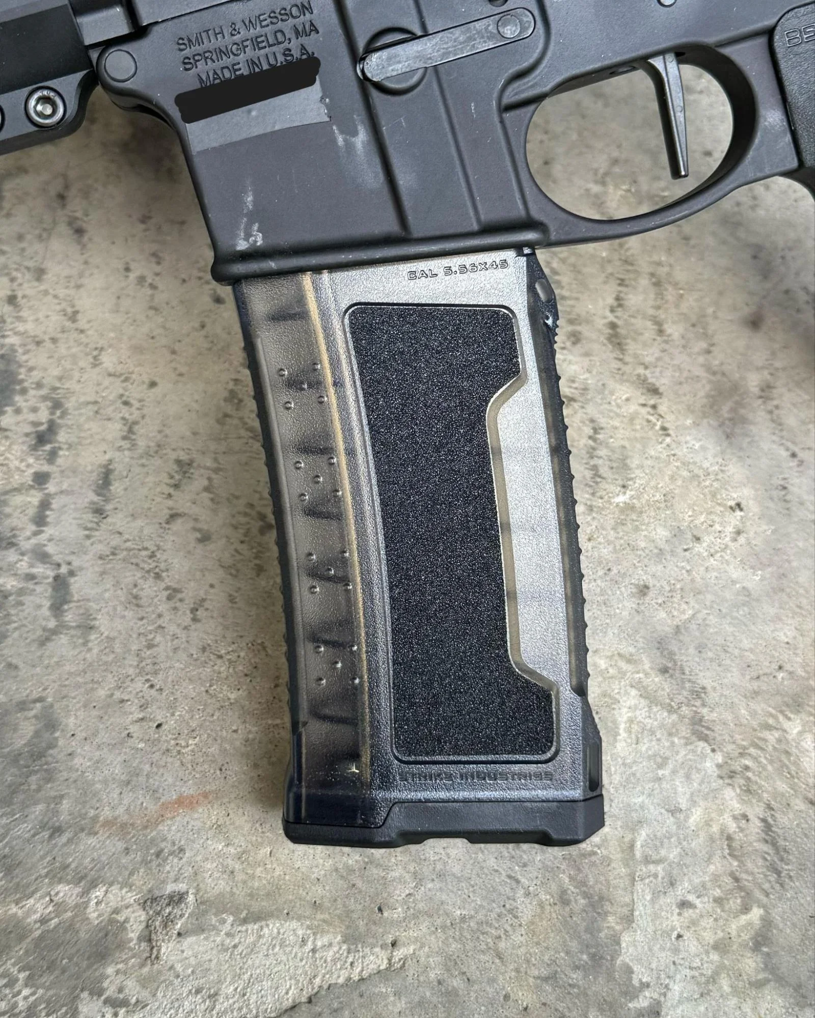 Close-up of the Strike AR-15 magazine, focusing on the over-insertion stop feature that ensures proper seating in the firearm