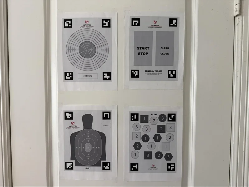 First-person point-of-view (POV) of the Mantis TitanX sights aligned for an outdoor dry-fire session to practice sight alignment