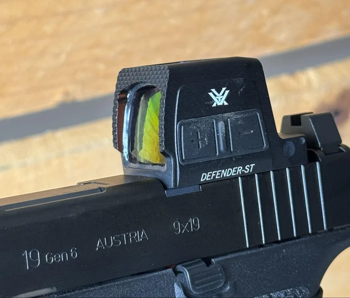 Side profile view showing the integrated top solar panel and front Fast-Rack texturing on the Vortex Defender-ST Enclosed Solar