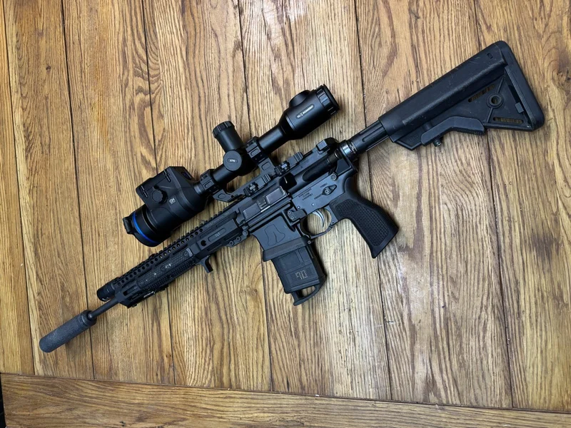 Pulsar Thermion 2 LRF XL60 in a Midwest Industries QD high-rise mount on our Liberty Bell rifle on wood floor