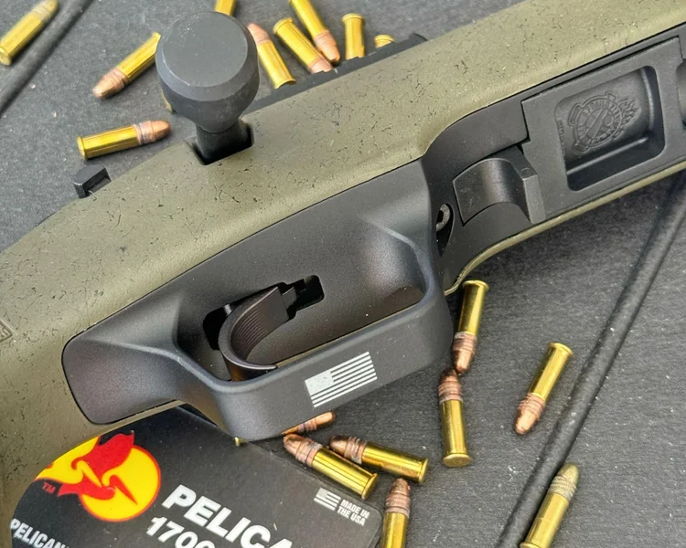 Close-up detail of the Model 2020 Rimfire’s oversized magazine release, designed for ease of use and fast magazine swaps
