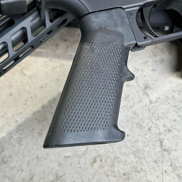 An image showcasing an outdated and basic AR-15 pistol grip, displayed to highlight their lack of features and old-school design compared to modern options