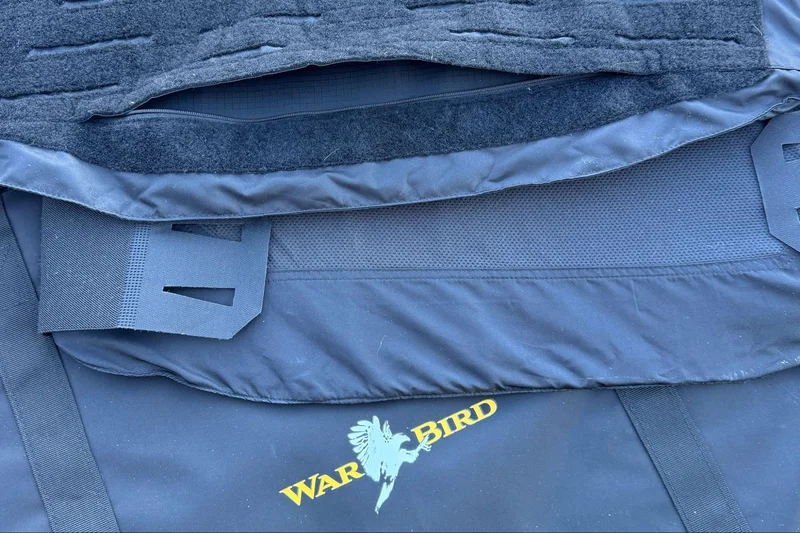 Close-up of the secure hook-and-loop system and zipper feature of the SkyFlex IIIA Armor