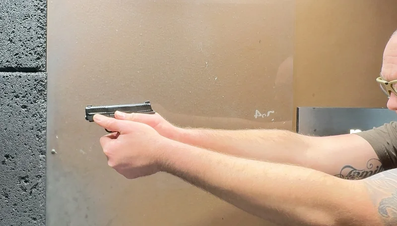 Aiming and firing a Smith & Wesson Bodyguard 2.0 pistol at a shooting range