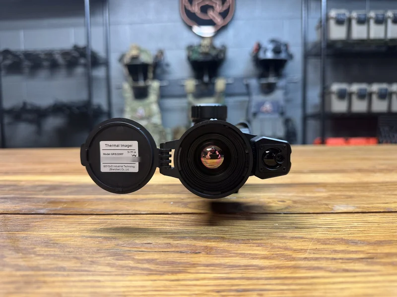 Front of the Goyojo GRS225RF showing the objective lens, the laser rangefinder window and the open lens cap