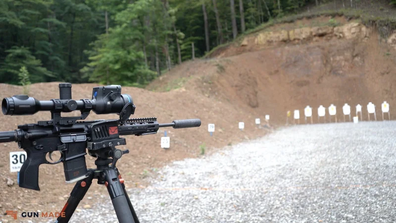 Pulsar Thermion 2 LRF XL60 on suppressed Liberty Bell rifle on tripod, 30-yard marker and targets downrange.