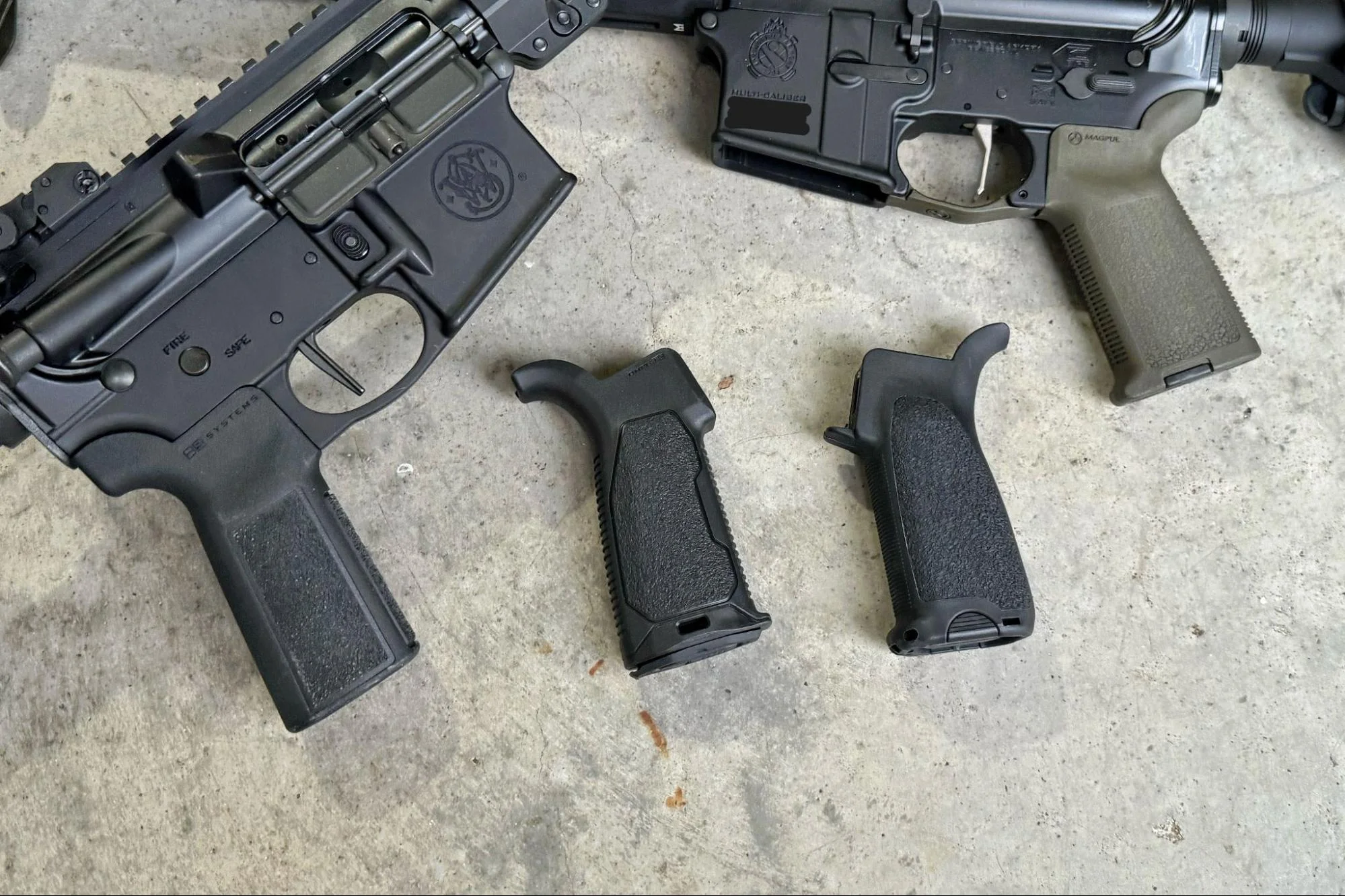 A photo depicting a person pondering over an array of modern AR-15 pistol grips, each with different features and designs, illustrating the variety and choices available to shooters