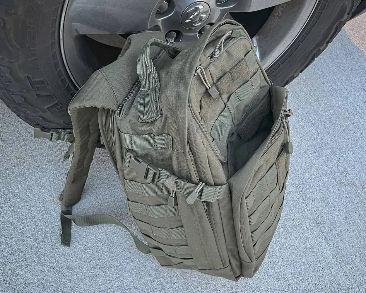 5.11 rush 24 2.0 tactical backpack sitting against truck tire